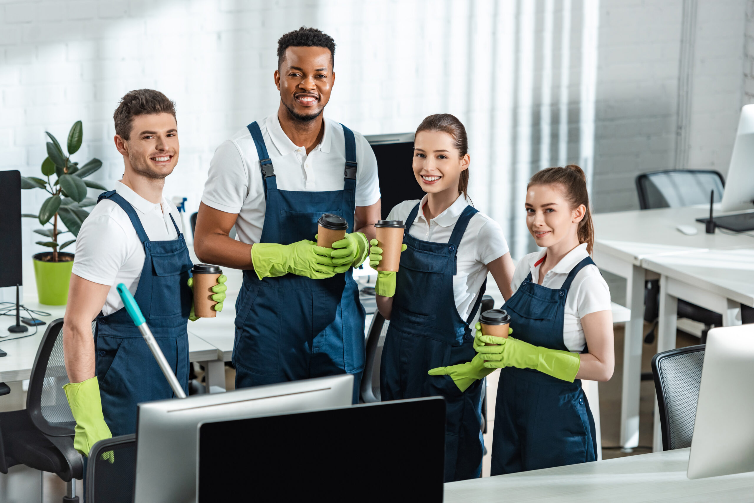 cheerful multicultural cleaners looking at camera 2024 11 15 03 07 45 utc scaled